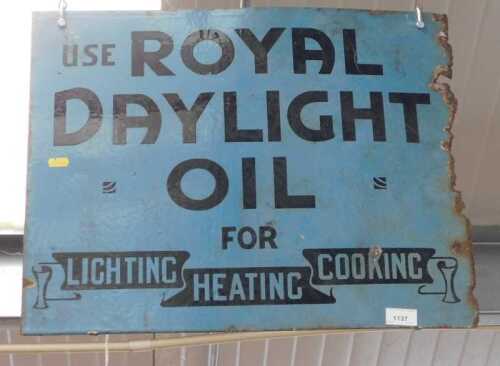 V - An early 20thC enamel sign, Use Royal Daylight Oil For Lighting Heating Cooking, in blue with...