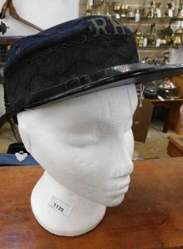 V - An early 20thC Chelsea Pensioners cap, with RH emblem, in blue, 13cm high, together with a...