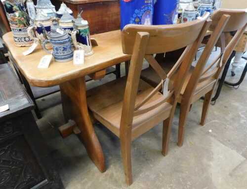 V - A 20thC rustic pine dining suite, comprising table with chamfered top and two chairs, each with...