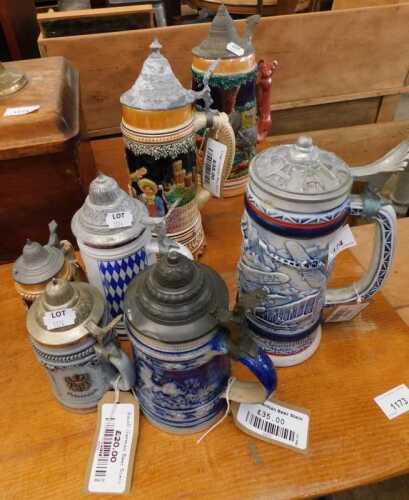 V - Various pottery beer steins, including one with a fox handle, with metal mounts, 33cm high, etc....