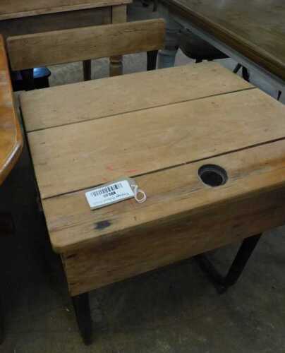 V - An early 20thC beech and cast iron child's desk, with fixed seat and space for an inkwell, 76cm...