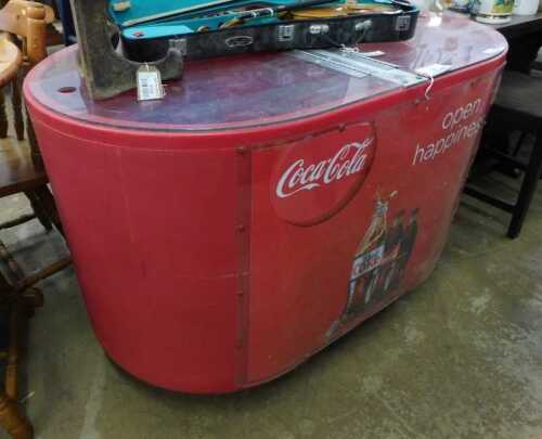 V - A Coca-Cola advertising ice pusher, with front sign marked Open Happiness, in white lettering on...