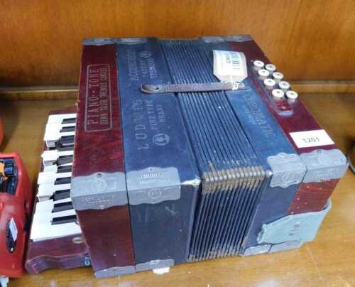 V - A 20thC Ludwig Piano-Tone piano accordion, marked Down South Tremold Concert, with hessian-style...