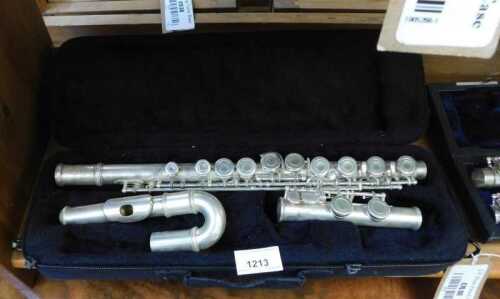 V - An early 20thC chrome plated three piece flute, in fitted case, 41cm wide. NB. VAT is payable on...