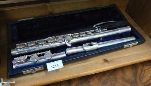 V - A 20thC chrome plated three piece flute, in fitted case, 41cm wide. NB. VAT is payable on the...