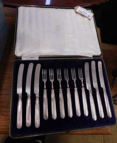V - A silver-handled starter knife and fork set, in part fitted case. NB. VAT is payable on the...