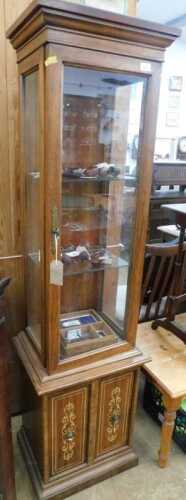 V - A narrow oak display cabinet, with a three-part glazed top, with fixed shelves, above a double...