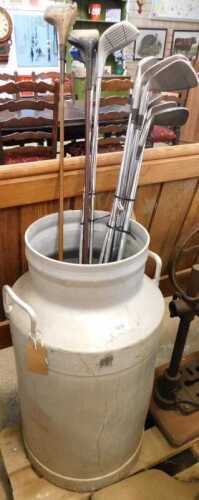 V - An aluminium milk churn, of circular form, with fixed handles, 70cm high, together with various...
