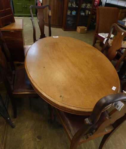 V - A 19thC mahogany and walnut loo table, of oval form, with heavily carved legs, on scroll feet,...