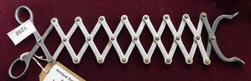 V - A set of steel ember tongs, 36cm long extended. NB. VAT is payable on the hammer price. CAVEAT...