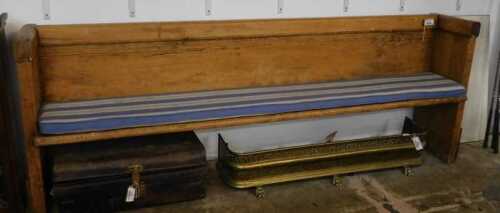 V - A principally 19thC pine pew, 88cm high, 232cm wide, 44cm deep. NB. VAT is payable on the hammer...