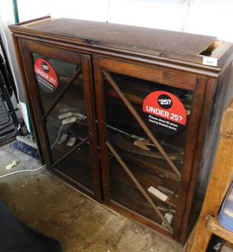 V - A late 19thC hanging cupboard, with glazed doors, 92cm high. (AF) NB. VAT is payable on the...