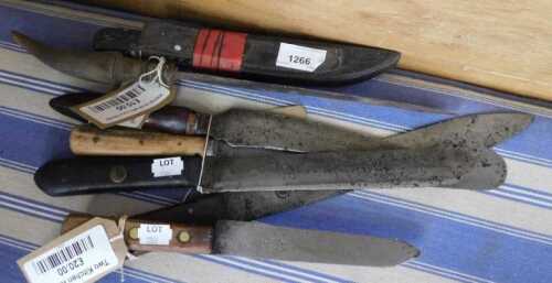 V - A 20thC dagger, with plain curved blade and plain scabbard with turned handle, 23cm long,...