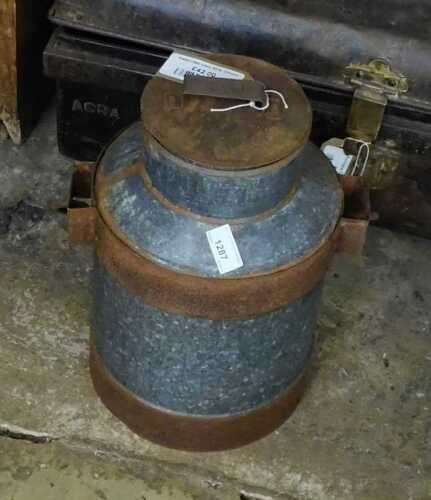 V - An early 20thC part iron milk churn, of circular form, with removable lid and swing handle, the...