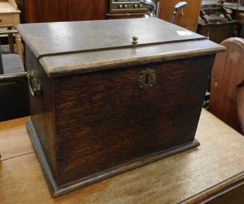 V - An early 20thC shoe shine box, of rectangular form, with brass escutcheon and side handles, 28cm...