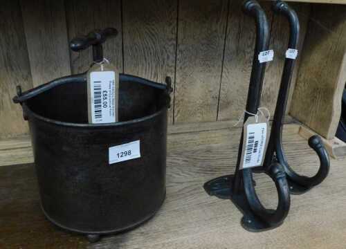 V - A 19thC metal fruit press, with central handle, on orb feet, 30cm high, and a pair of GWR coat...