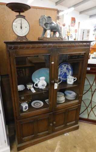 V - Various metalware, pottery and effects, an Old Charm display cabinet, glazed doors above double...