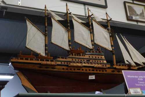 V - A wooden model of a galleon, with realistic deck, rigging and masks, on a wooden stand, 53cm...