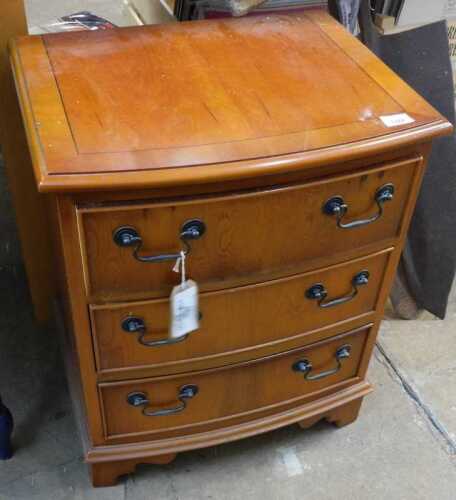 V - A small D end yew wood chest, of three drawers, on ogee bracket feet, with a wide crossbanding,...