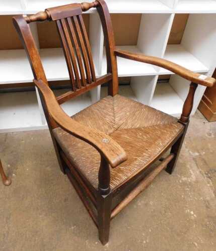 V - A 19thC elm carver chair, of small proportion, on square tapering legs joined by a horizontal...