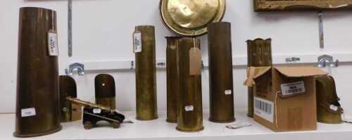V - Various brassware, a quantity of trench art shell cases, mainly of plain form, to include a...