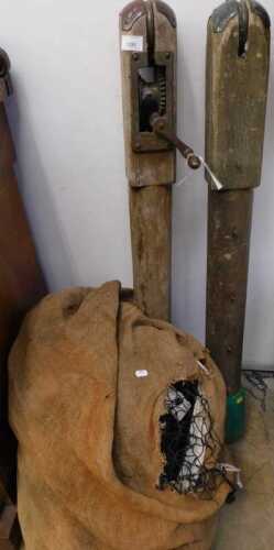 V - A vintage Slazenger tennis net set, comprising wooden post with metal mounts, marked Slazenger,...