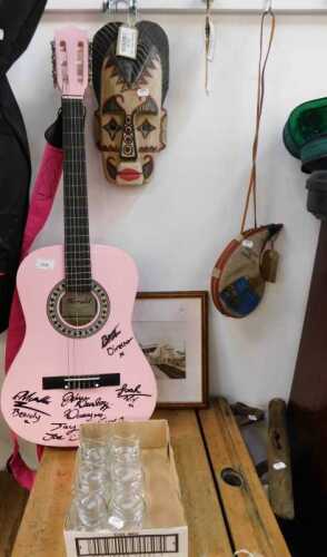 V - Various collectable items, a Herald acoustic guitar, in pink, partially signed by various...