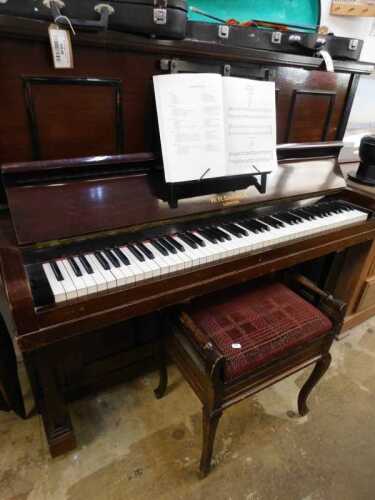 V - An early 20thC walnut stained upright piano, marked W H Barnes, 135cm high, with associated...
