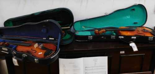 V - Various practice and other violins, a Lark violin with 34cm long body, scroll end, and bow, in...