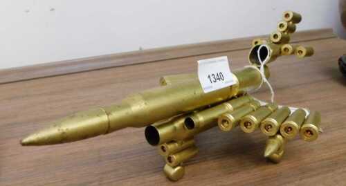 V - A trench art style aeroplane made from spent bullets, 25cm long. NB. VAT is payable on the...