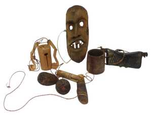 A group of Vietnamese Xedang/Sedang wares, to include a carved wooden mask, 32cm high, a novelty...