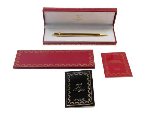 A Must de Cartier Paris Stylo Bille ballpoint pen, serial number 489297, in a fitted case,...