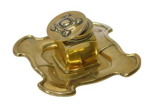 An Art Nouveau brass inkwell, the hinged lid opening to reveal a brass inkwell, on a shaped base,...