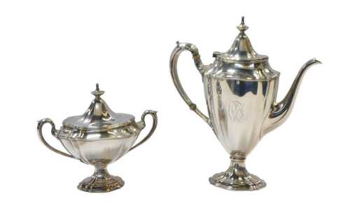 A William IV silver twin handled sugar bowl and cover, of urn form, initialled, raised on a...