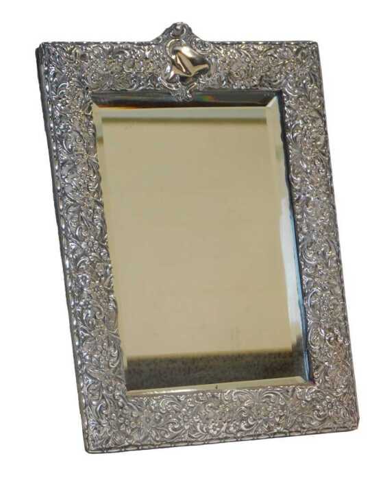 A late Victorian silver mounted strut photograph frame, of rectangular form, decorated with...