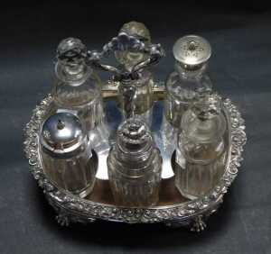 A George IV and later silver cruet stand, of oval form, the border decorated with scrolls and... - 2