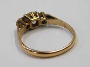 A 9ct gold dress ring, set with three imitation diamonds, one square cut and two round brilliant... - 2