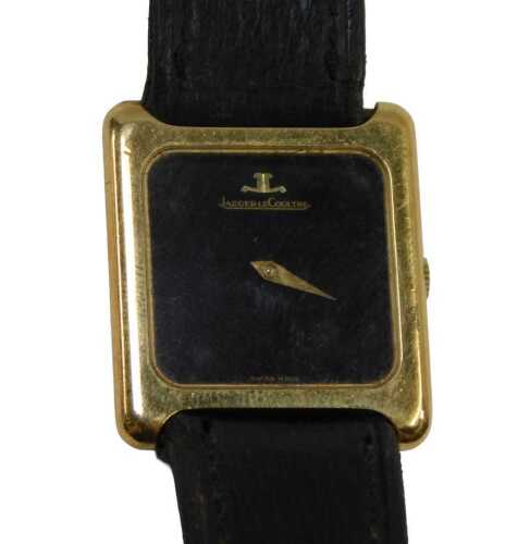 A Jaeger-LeCoultre lady's wristwatch, with a rectangular and black faced dial, in a gold plated...