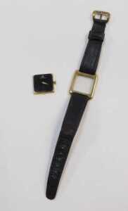 A Jaeger-LeCoultre lady's wristwatch, with a rectangular and black faced dial, in a gold plated... - 5