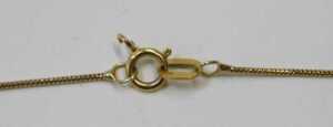 A 9ct gold pendant and chain, the scroll work pendant set with a sapphire and a diamond, of... - 3