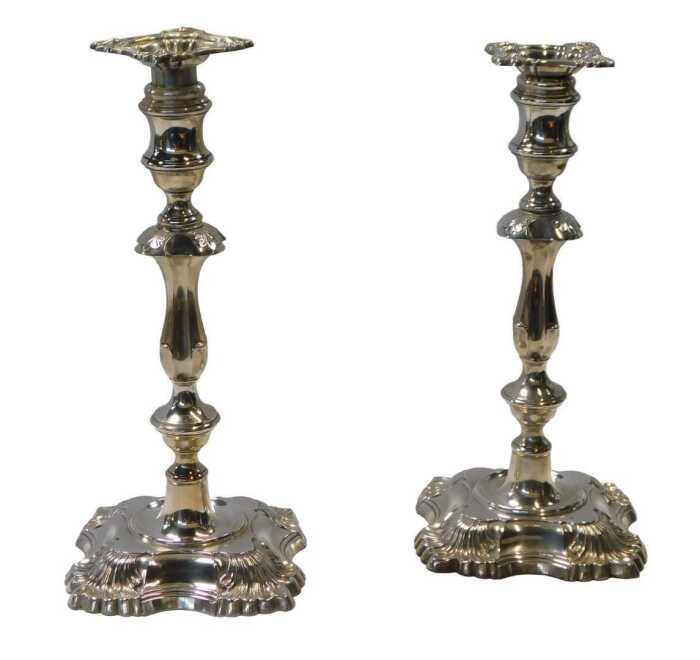 A pair of George V loaded silver candlesticks, with leaf cast decoration, William Hutton and...