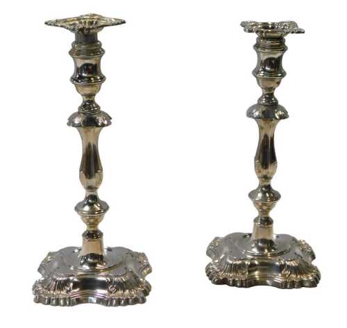 A pair of George V loaded silver candlesticks, with leaf cast decoration, William Hutton and...