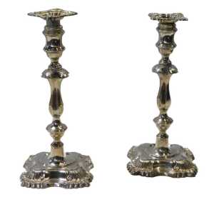 A pair of George V loaded silver candlesticks, with leaf cast decoration, William Hutton and...