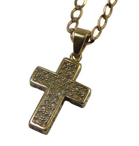 A cross pendant and chain, the gem encrusted cross, with arched pendant mount, 3cm high, on a...