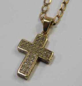 A cross pendant and chain, the gem encrusted cross, with arched pendant mount, 3cm high, on a... - 2