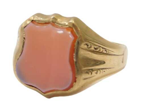 A gent's signet ring, set with a sardonyx, on a yellow metal coloured band, unmarked, showing...