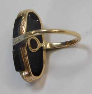 An Art Deco style dress ring, set with a panel of jet and centred by seed pearl, with platinum... - 2