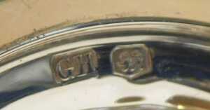 A George V silver hot water jug, of baluster form, with an ebonised handle, raised on a circular... - 3