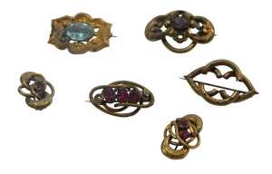 Six 19thC and later gilt memorial style brooches, five set with paste stones. (AF)