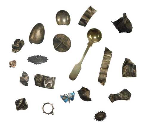 A group of white metal mounts, walking canes, cheroots, bottle tops, and an enamel butterfly...